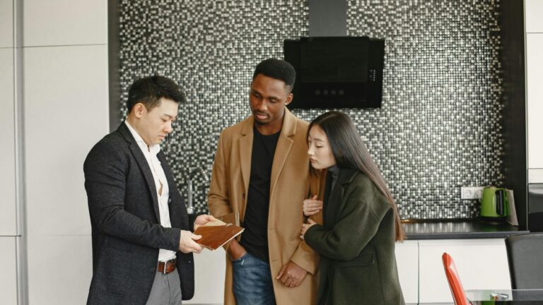 Real estate agent showing house to clients